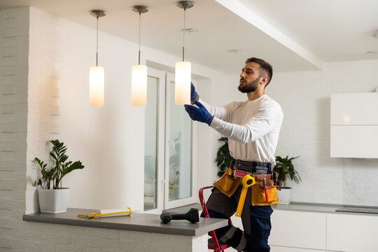 Electrician installing pendant lights in kitchen Pasadena CA