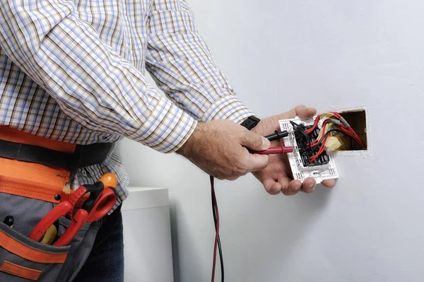 Electrician repairing outlet Pasadena CA